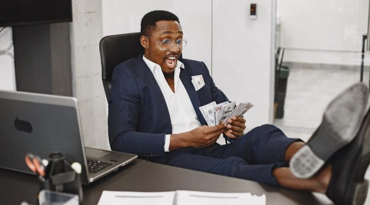 african-man-black-suit-guy-sitting-table-businessman-with-money